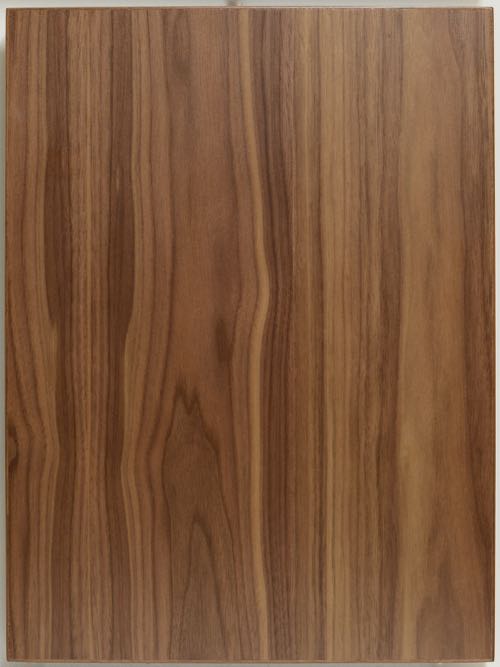 Walnut Flat Cut veneer slab style cabinet door with solid edge.
